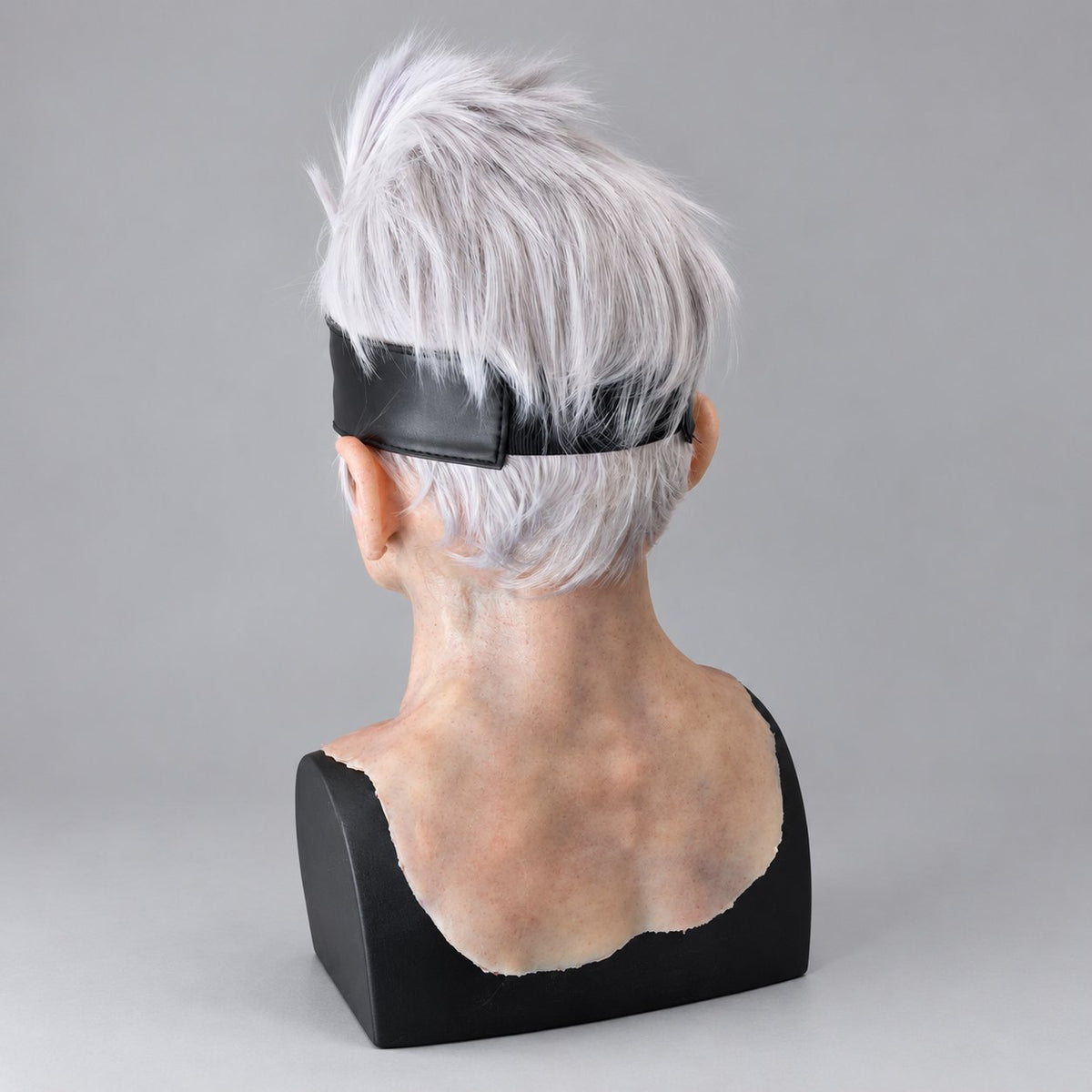 Handcrafted white-haired silicone character mask, back view