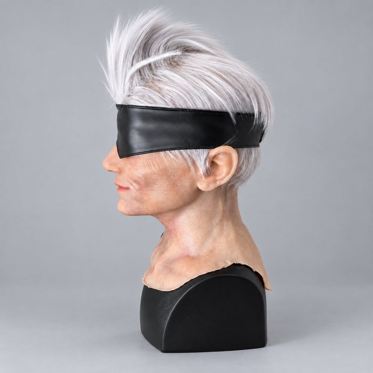 Handcrafted white-haired silicone character mask, left profile